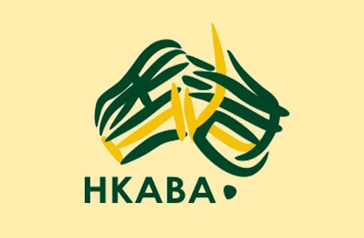 Logo showing intertwined green and yellow ribbons forming a handshake above the letters HKABA on a pale yellow background.