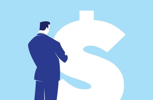 Businessperson in a dark blue suit standing beside a large white dollar sign on a light blue background.