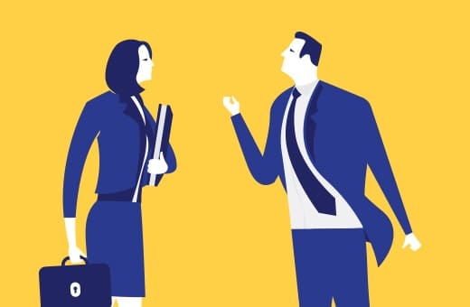 Two business professionals in blue suits converse on a bright yellow background; the woman carries a briefcase and folders while the man gestures.
