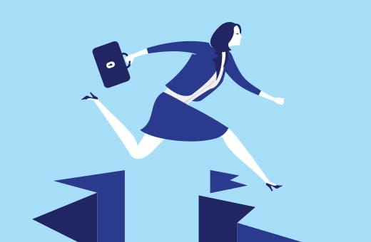 Businesswoman in a blue suit jumping over a gap between two platform blocks, briefcase in hand.